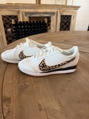 Women’s Nike White Sneakers with Leopard Swoosh Accent - excellent condition.